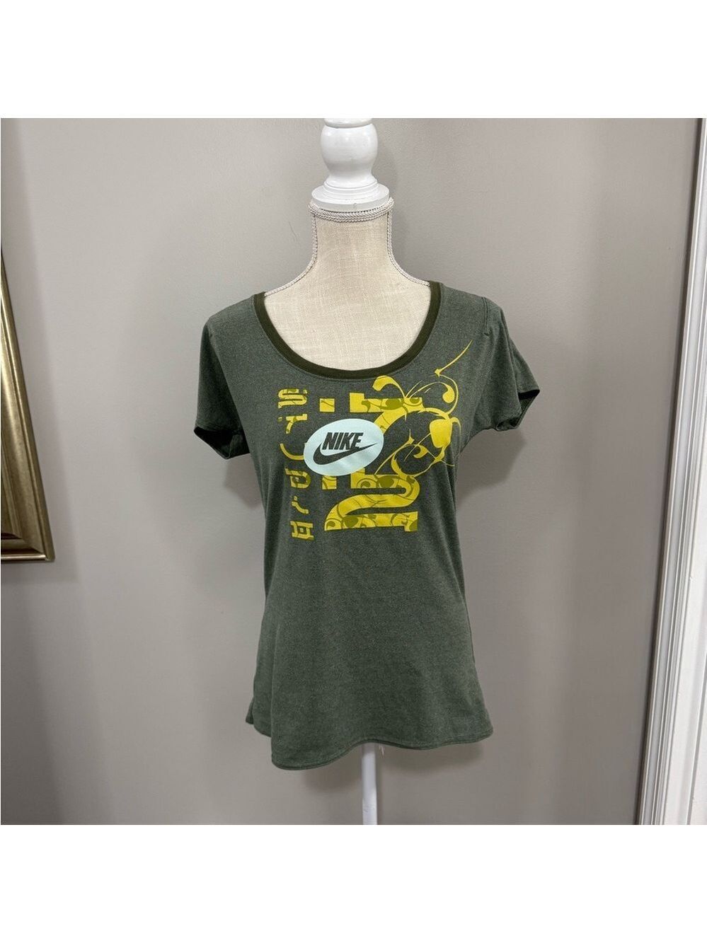 Women's Nike Olive Green Anime Graphic Athletic Shirt. Size M